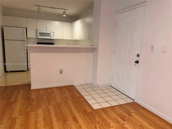 a view of kitchen with wooden floor