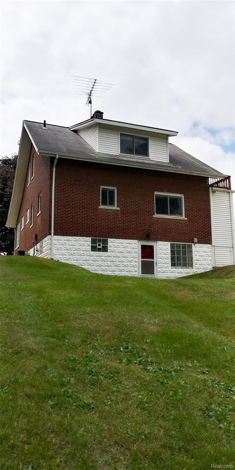 44778 Utica Road Utica, MI 48317 - Photo 6 of 26 Rear view of house showing walkout basement ready for your elevated deck to be installed.