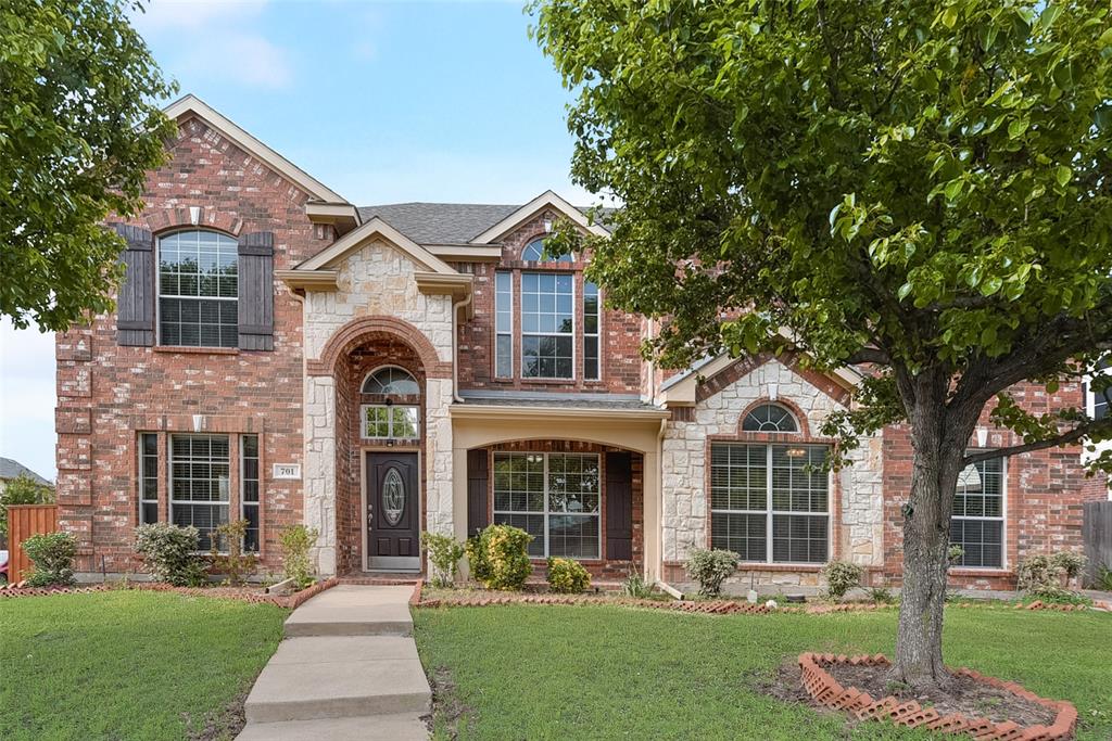 front view of a house with a yard