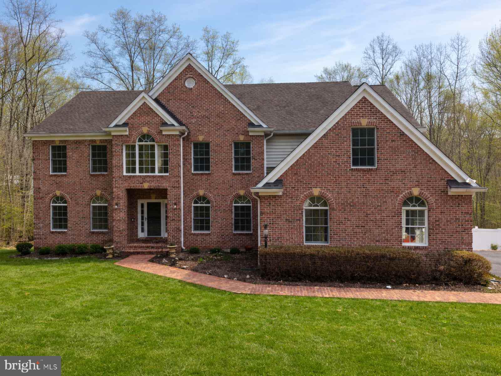 9401 Keyser Road Nokesville, VA 20181 - Photo 3 of 8 a front view of a house with a yard and garage