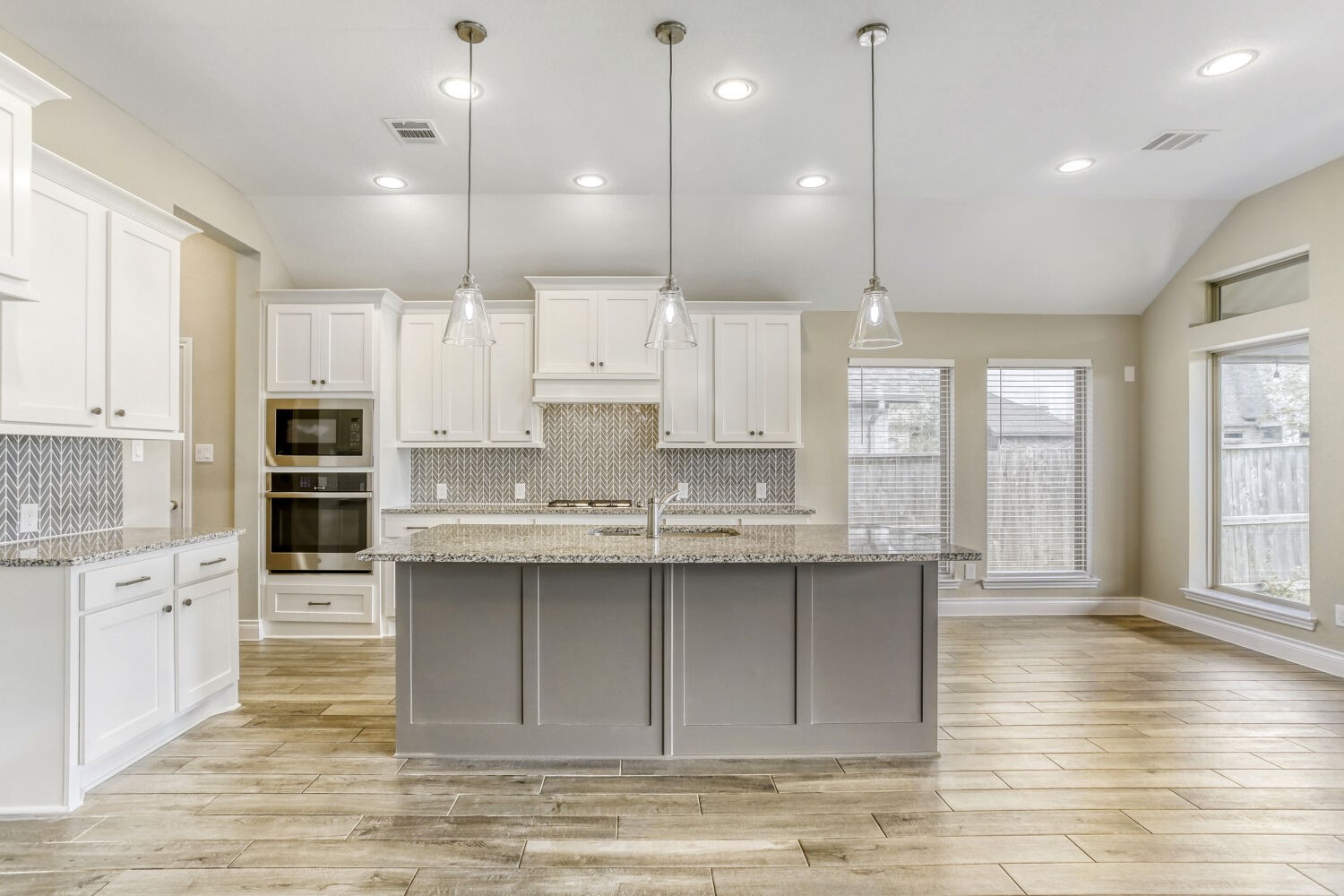 9219 Eckert Road Iowa Colony, TX 77583 - Photo 13 of 26 The island kitchen features abundant, freshly-painted cabinetry, and breakfast bar seating.