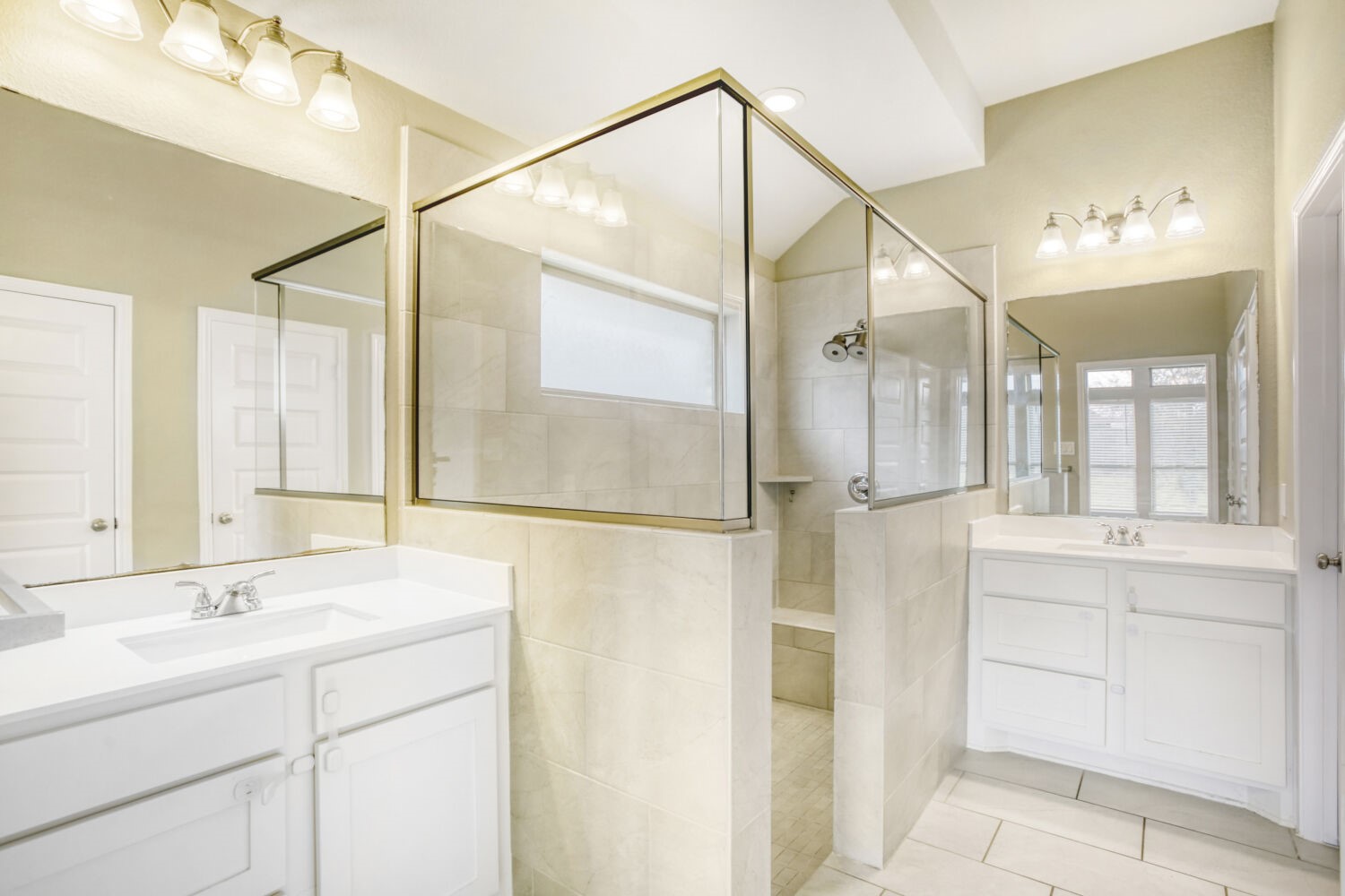 9219 Eckert Road Iowa Colony, TX 77583 - Photo 21 of 26 The primary ensuite bathroom has dual, seperate sinks, an oversized shower and walk-in closet.