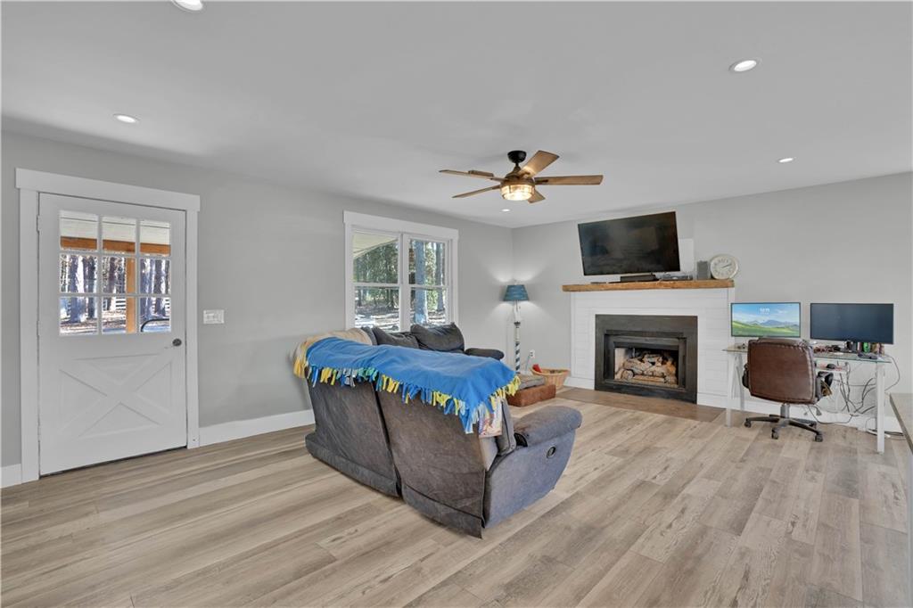 231 Cardinal Point Monticello, GA 31064 - Photo 20 of 40 a living room with furniture and a fireplace