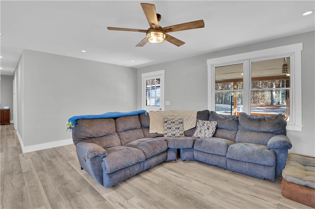 231 Cardinal Point Monticello, GA 31064 - Photo 21 of 40 a living room with furniture and a large window