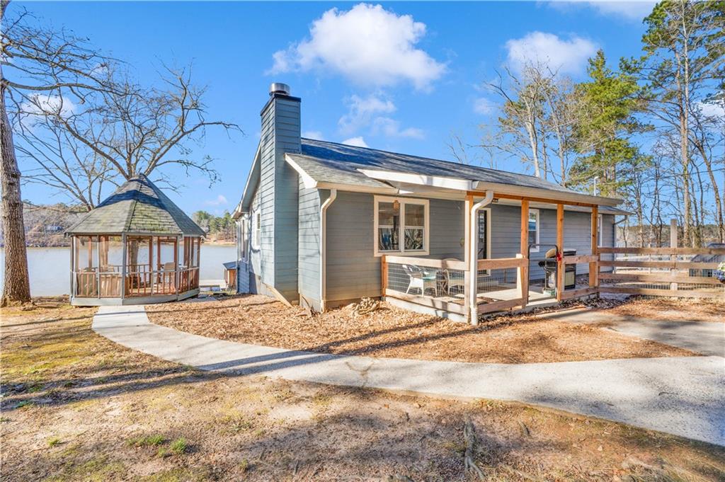 231 Cardinal Point Monticello, GA 31064 - Photo 3 of 40 a view of a house with a patio and a yard