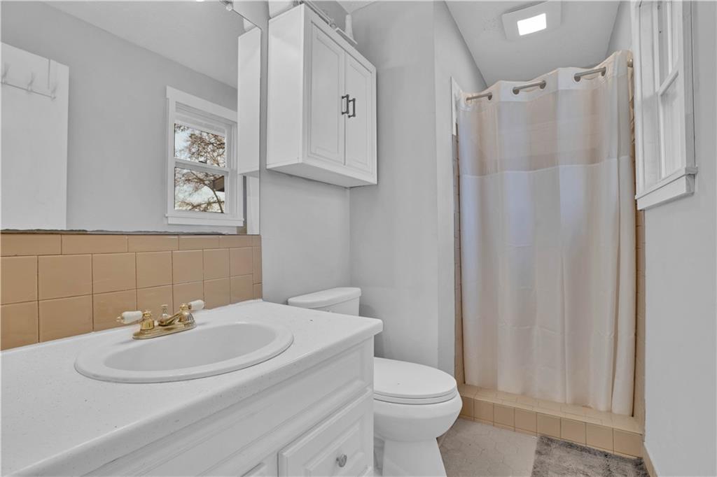 231 Cardinal Point Monticello, GA 31064 - Photo 34 of 40 a bathroom with a sink toilet and a mirror
