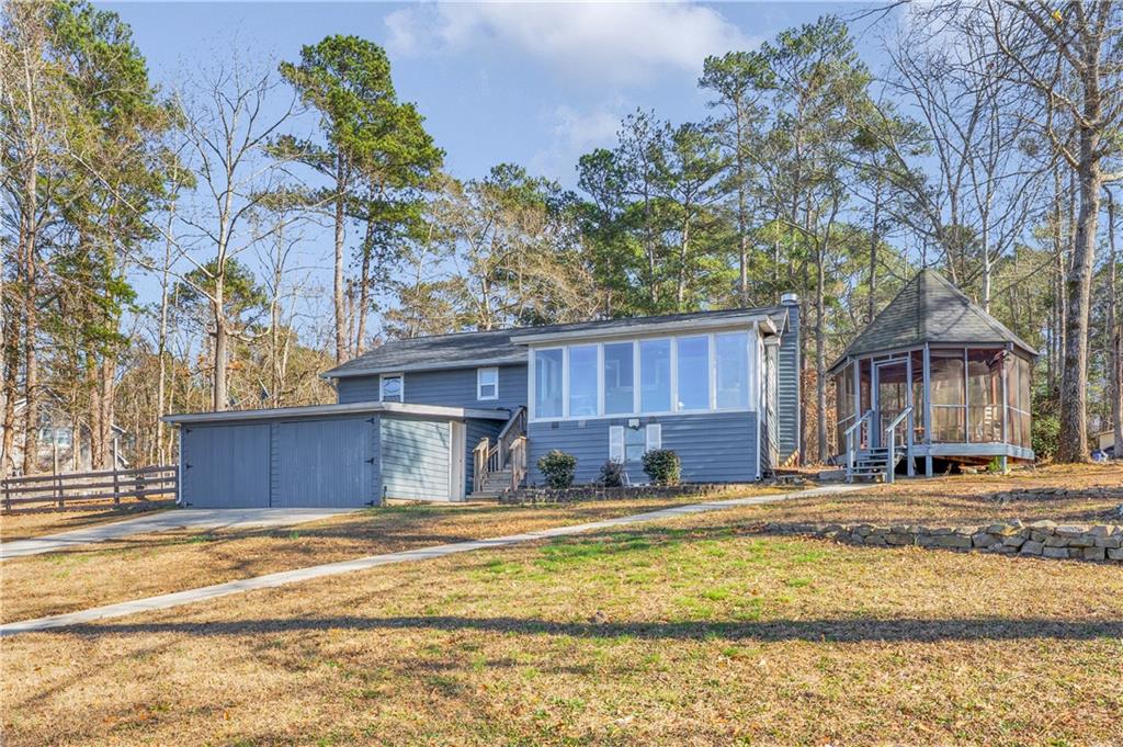 231 Cardinal Point Monticello, GA 31064 - Photo 8 of 40 a house with a large tree in front of it