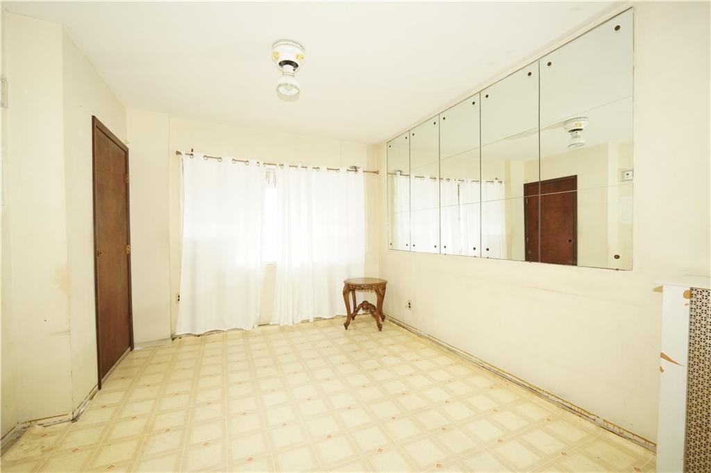 1636 Dahill Road Brooklyn, NY 11223 - Photo 16 of 19 a bathroom with a bathtub and a shower