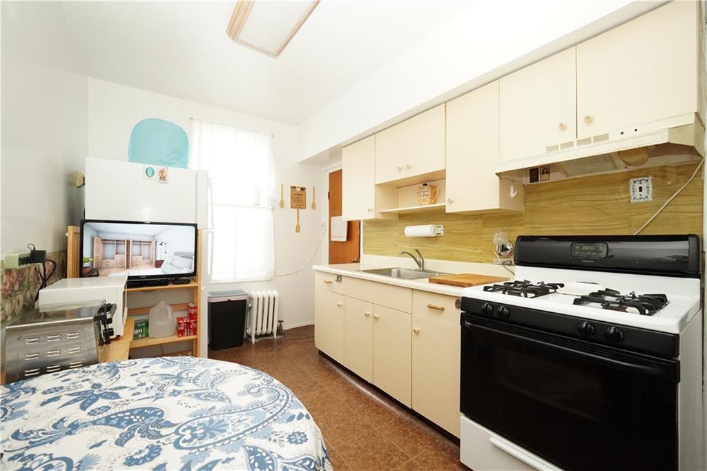 1636 Dahill Road Brooklyn, NY 11223 - Photo 8 of 19 a kitchen with stainless steel appliances granite countertop a stove and a refrigerator