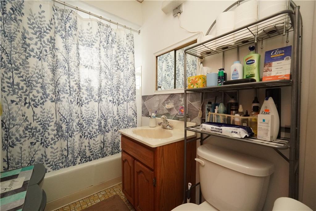 1636 Dahill Road Brooklyn, NY 11223 - Photo 9 of 19 a bathroom with a sink and a toilet