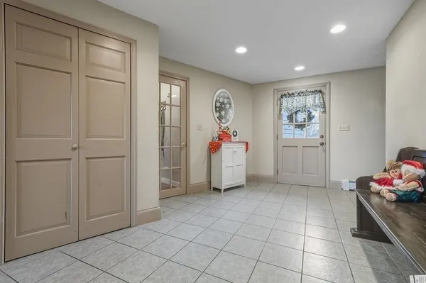 a view of kitchen with furniture and white walls