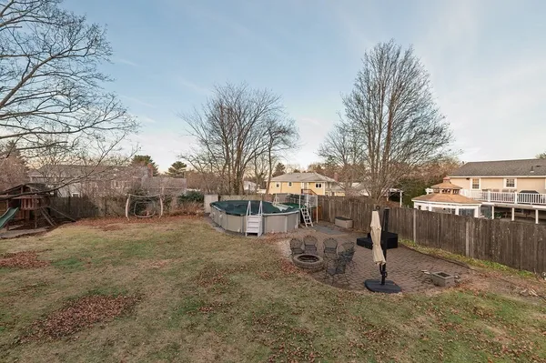 a view of a yard with a tree