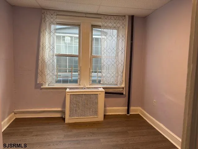 an empty room with a fireplace