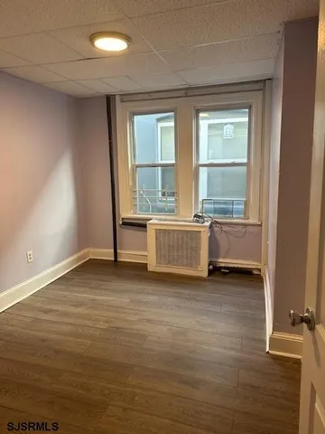 a white toilet sitting next to a window