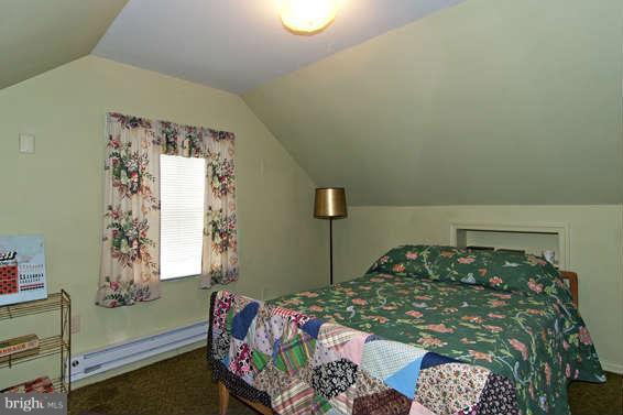 4523 Maple Road Morningside, MD 20746 - Photo 18 of 19 a bedroom with a bed and a window
