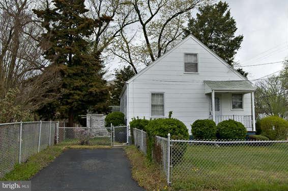 4523 Maple Road Morningside, MD 20746 - Photo 4 of 19 a front view of a house with garden