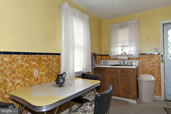 4523 Maple Road Morningside, MD 20746 - Photo 9 of 19 a kitchen with a sink a stove and a refrigerator