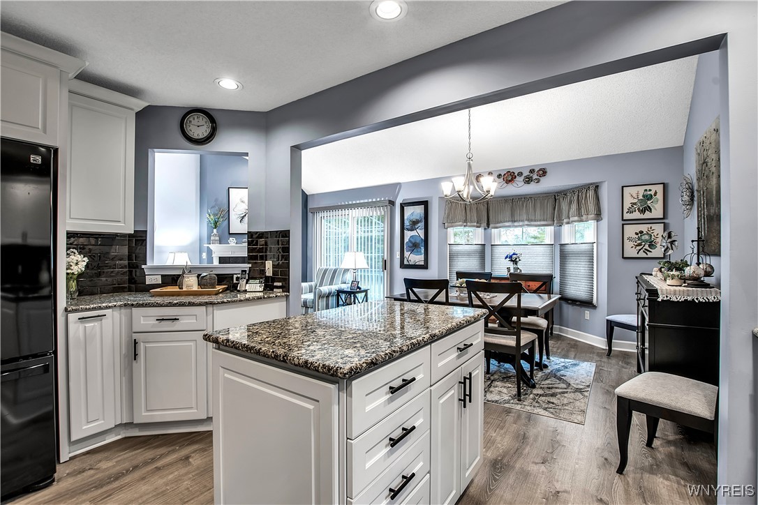 2850 Amsdell Road, Unit 1 Hamburg, NY 14075 - Photo 11 of 50 KIT: Overlooks DR - cut out view to LR