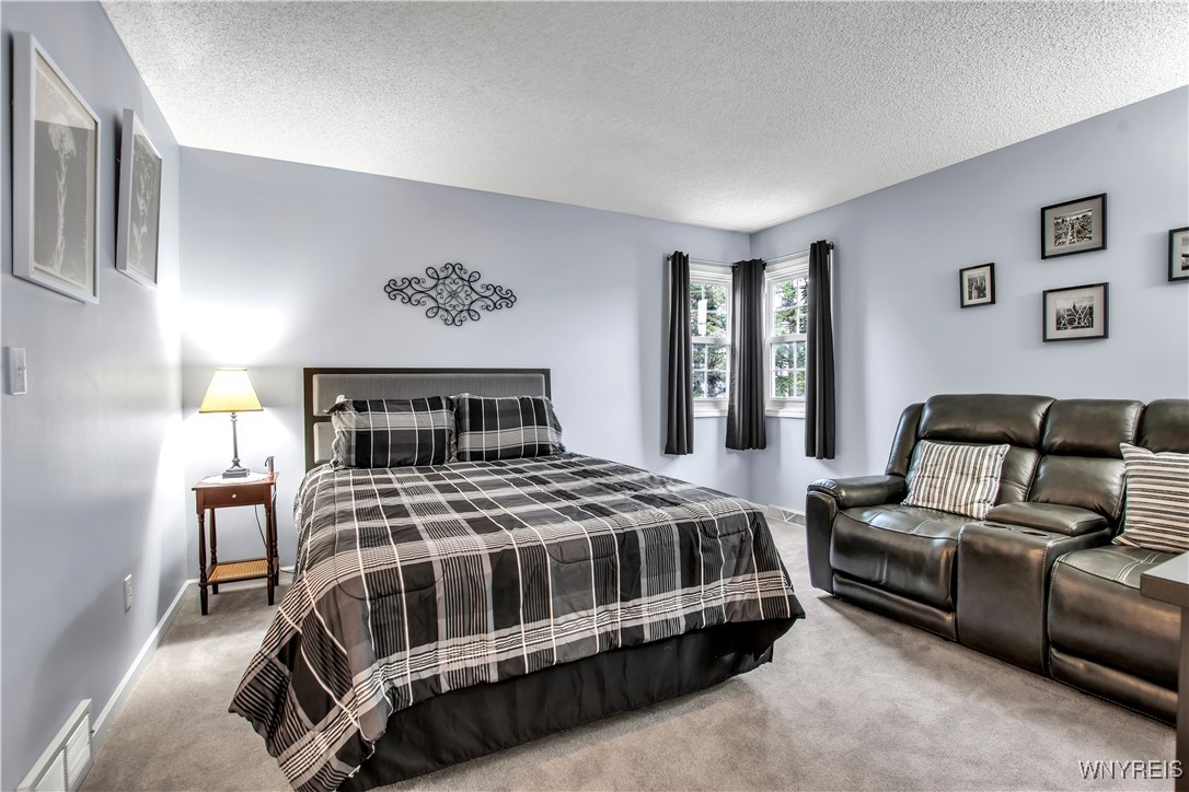 2850 Amsdell Road, Unit 1 Hamburg, NY 14075 - Photo 28 of 50 2nd flr carpeted BDRM, corner windows + walk-in cl