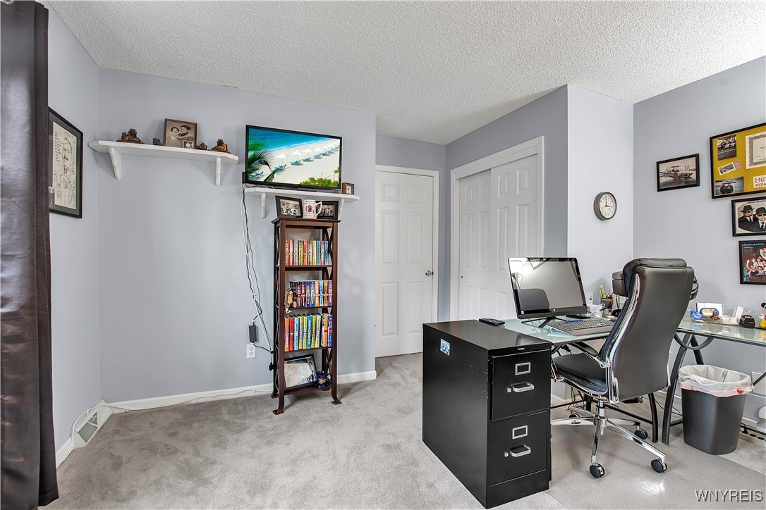 2850 Amsdell Road, Unit 1 Hamburg, NY 14075 - Photo 37 of 50 2nd flr carpeted BDRM: 6 panel closet w/sliding do