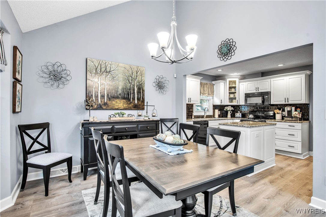 2850 Amsdell Road, Unit 1 Hamburg, NY 14075 - Photo 9 of 50 DR:Luxury vinyl flr, vaulted ceiling+pretty chande