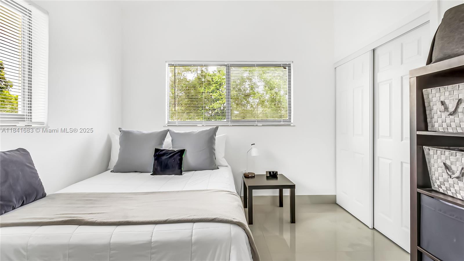 17101 Southwest 48th Street Southwest Ranches, FL 33331 - Photo 15 of 40 a bedroom with a bed and a window