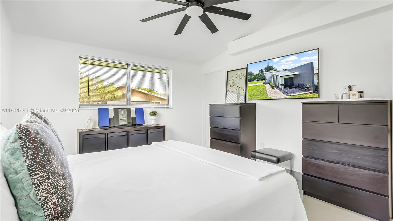 17101 Southwest 48th Street Southwest Ranches, FL 33331 - Photo 20 of 40 a bedroom with a bed and a dresser