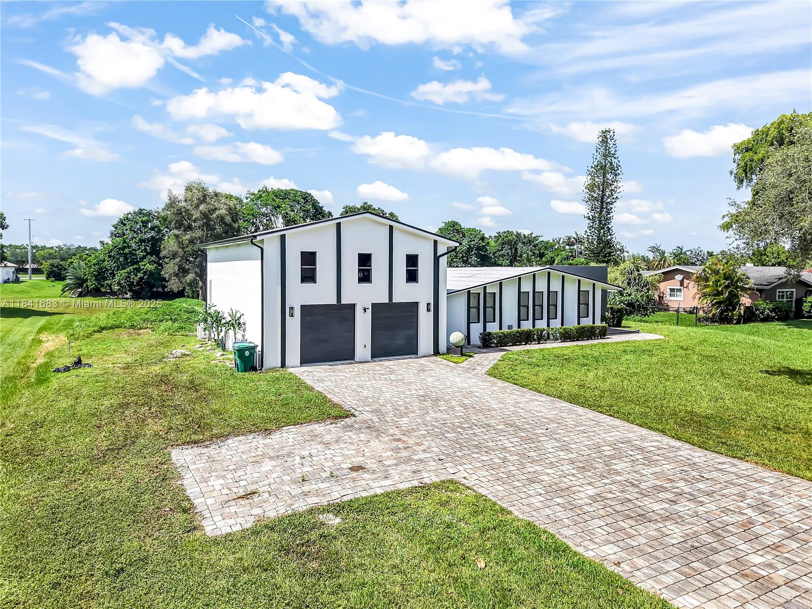 17101 Southwest 48th Street Southwest Ranches, FL 33331 - Photo 2 of 40 a view of a house with a yard