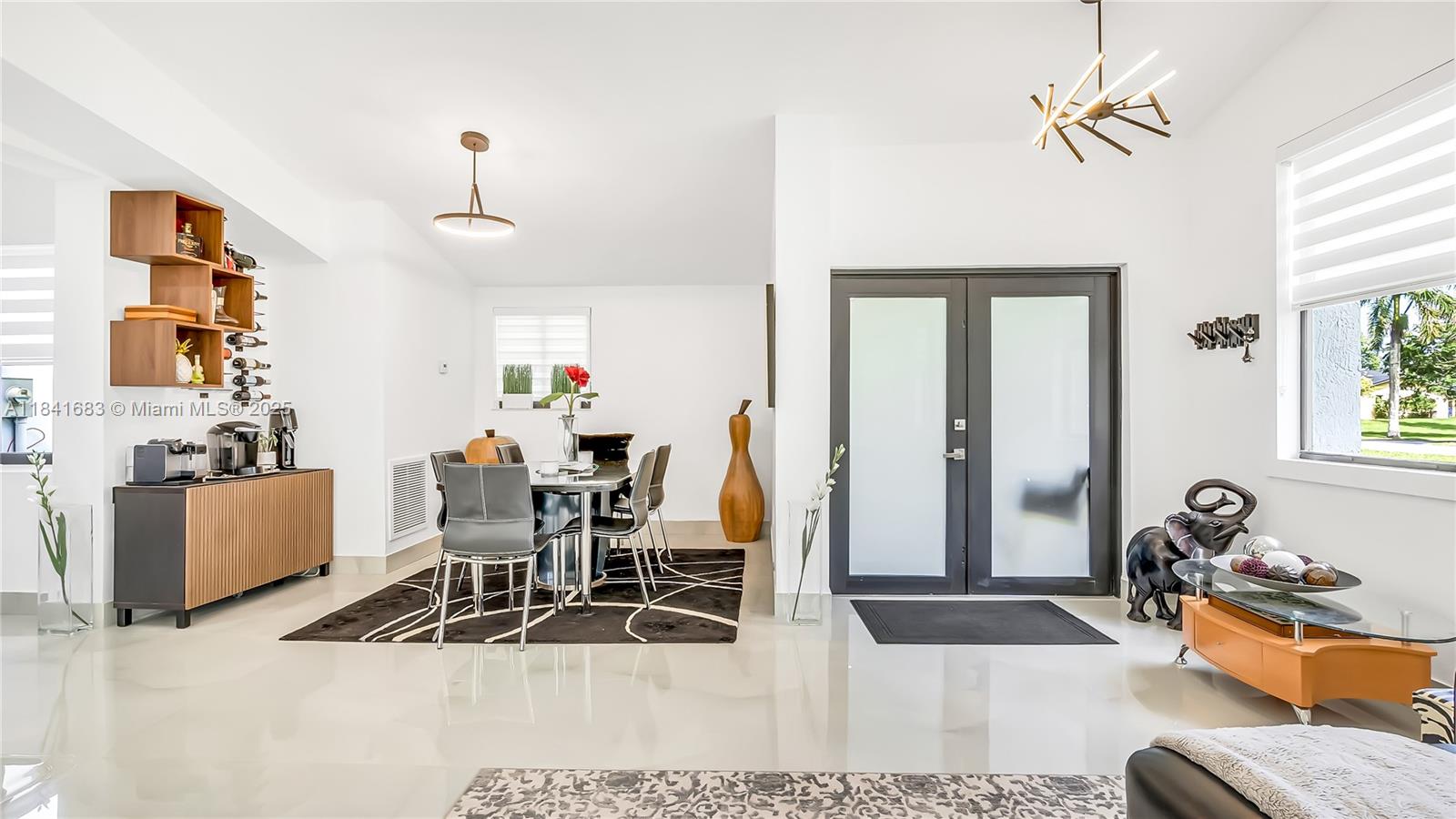 17101 Southwest 48th Street Southwest Ranches, FL 33331 - Photo 27 of 40 a living room with furniture a flat screen tv and a window