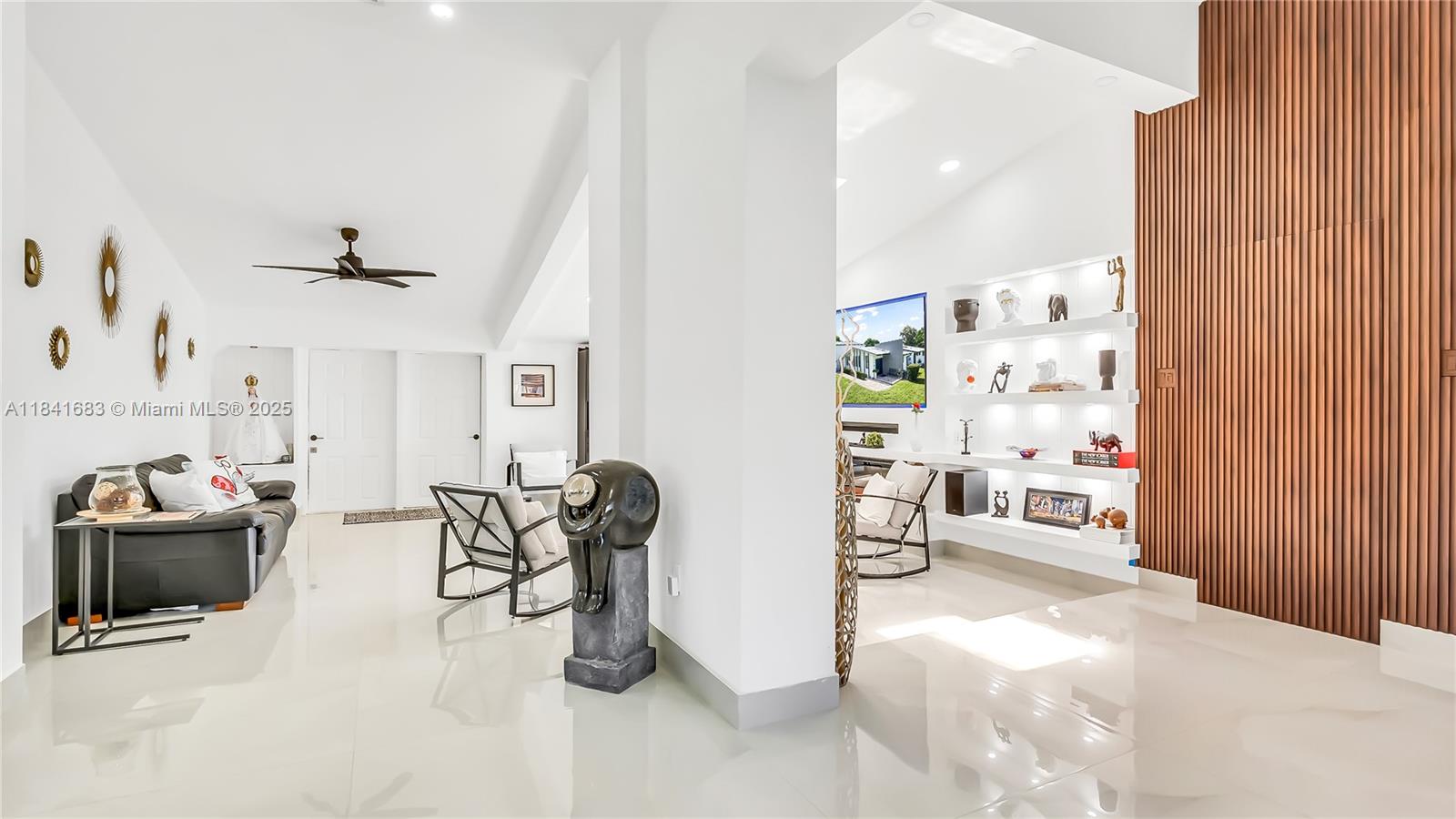 17101 Southwest 48th Street Southwest Ranches, FL 33331 - Photo 29 of 40 a living room with furniture and a window