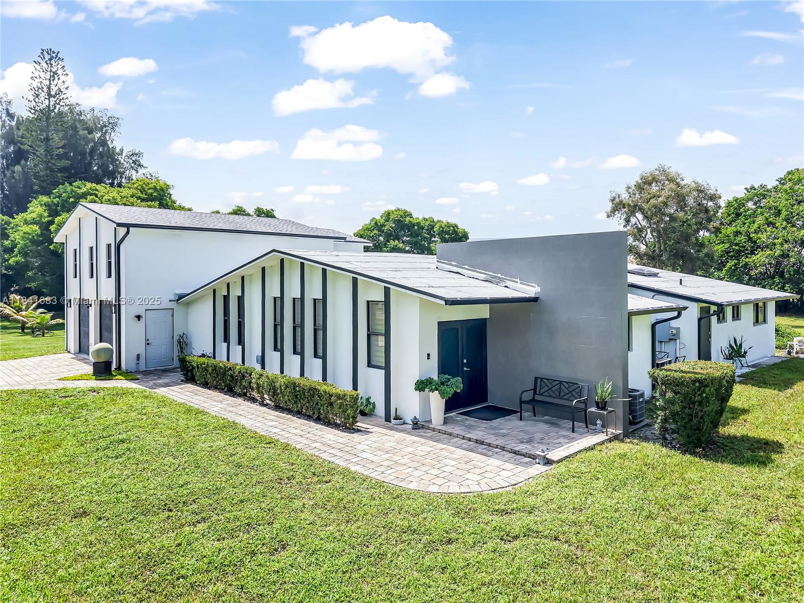 17101 Southwest 48th Street Southwest Ranches, FL 33331 - Photo 3 of 40 a view of a backyard with a garden