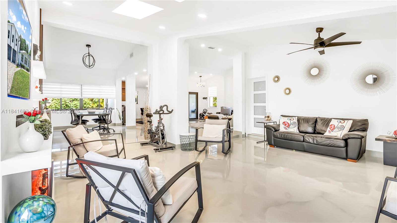 17101 Southwest 48th Street Southwest Ranches, FL 33331 - Photo 31 of 40 a living room with furniture and a large window