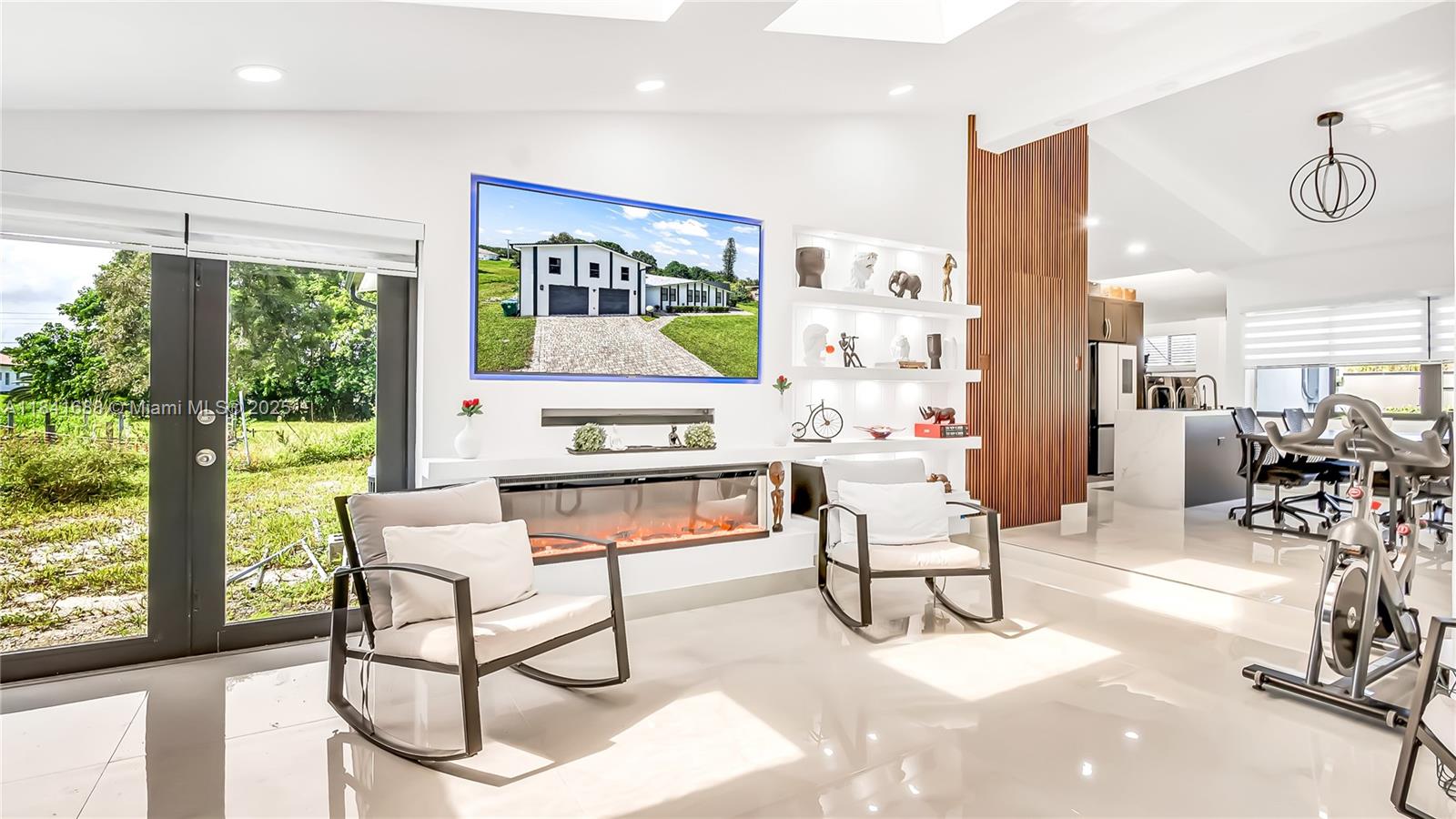 17101 Southwest 48th Street Southwest Ranches, FL 33331 - Photo 33 of 40 a living room with furniture a rug and a large window