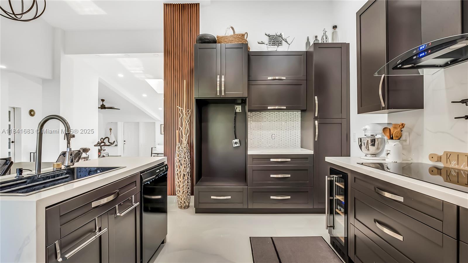 17101 Southwest 48th Street Southwest Ranches, FL 33331 - Photo 38 of 40 a kitchen with a sink and cabinets
