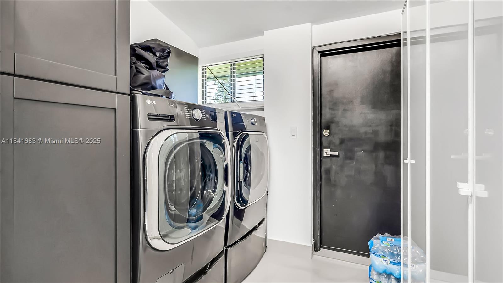 17101 Southwest 48th Street Southwest Ranches, FL 33331 - Photo 40 of 40 a utility room with dryer and washer