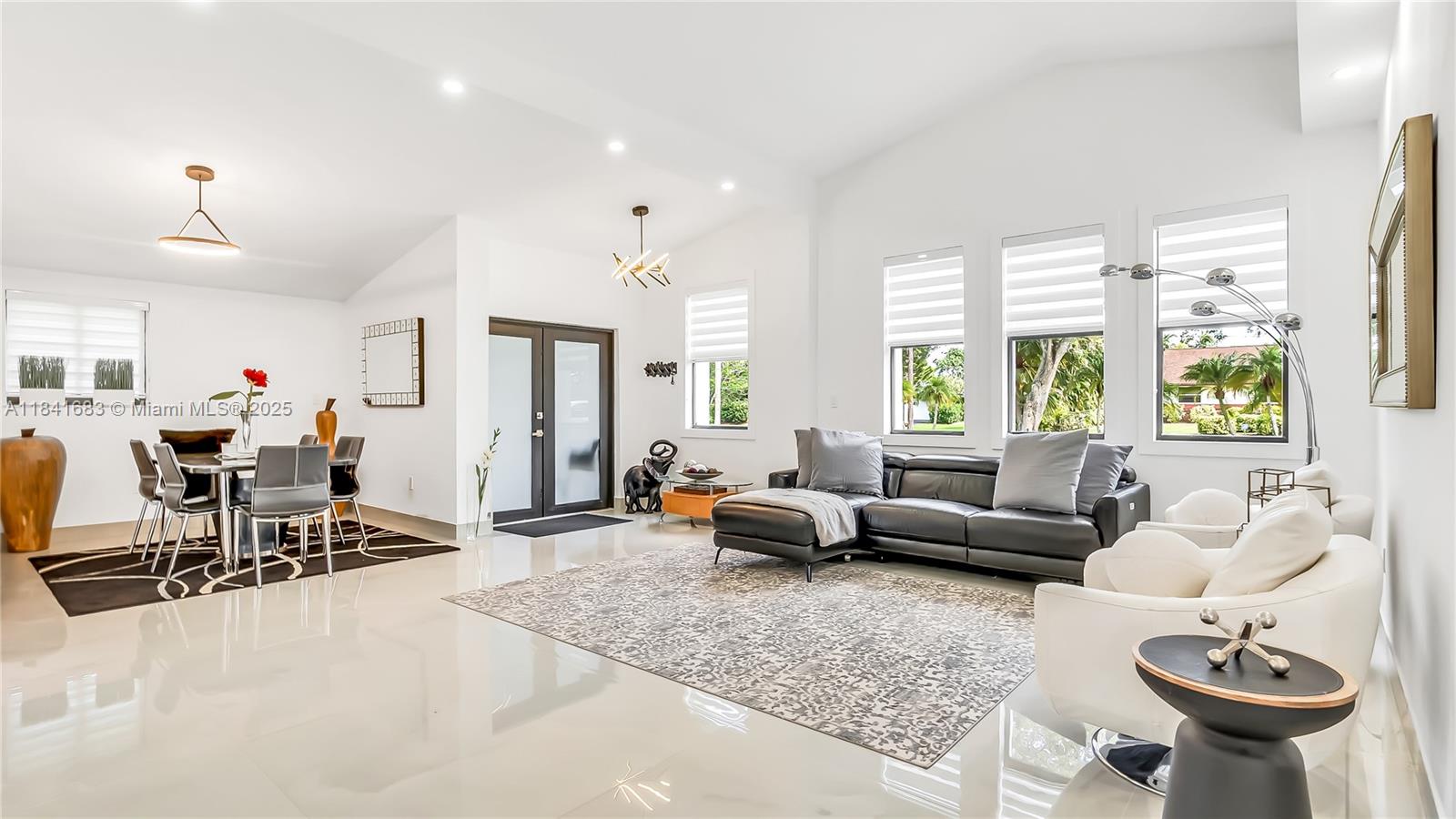 17101 Southwest 48th Street Southwest Ranches, FL 33331 - Photo 6 of 40 a living room with furniture and a large window