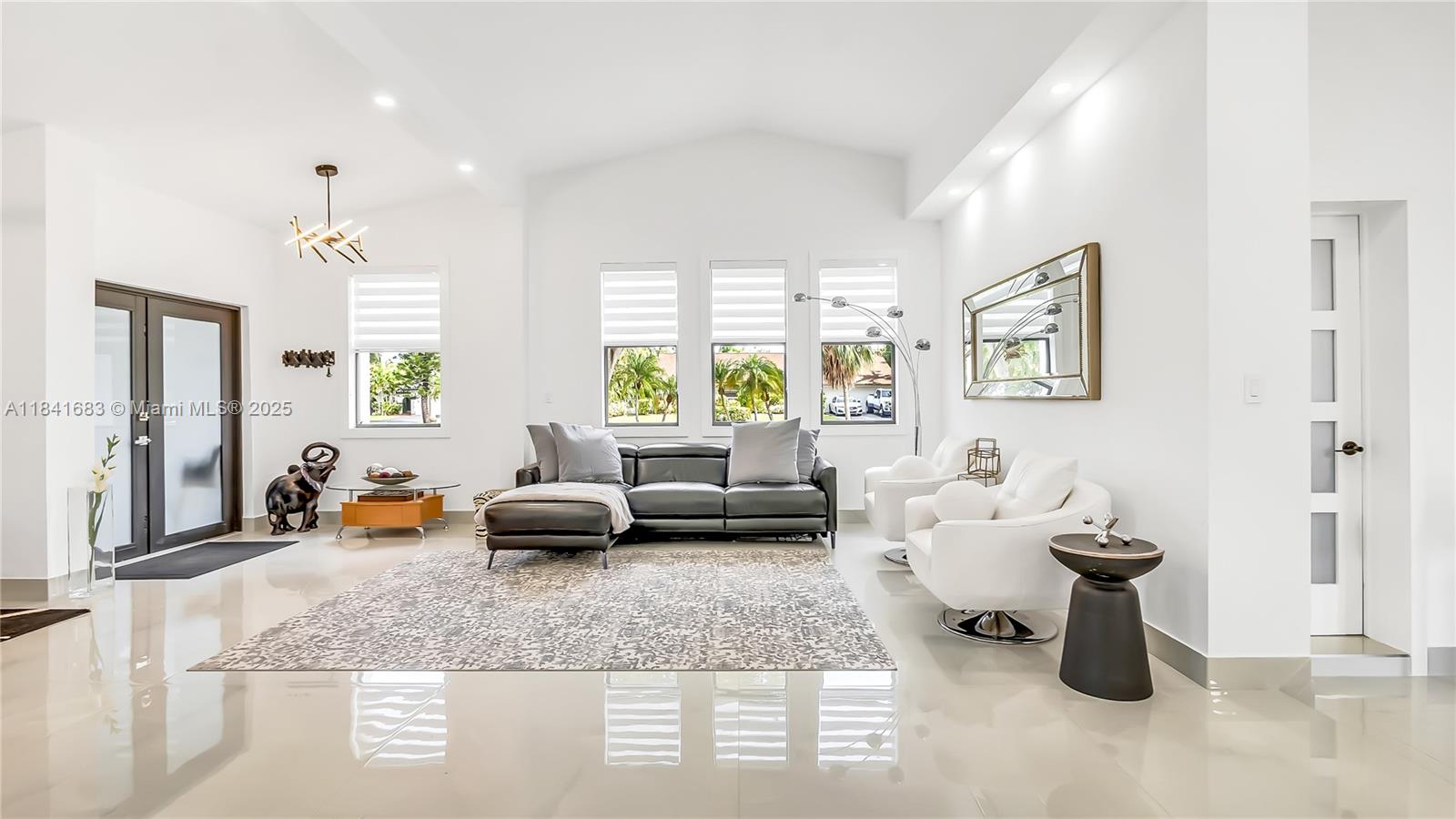 17101 Southwest 48th Street Southwest Ranches, FL 33331 - Photo 8 of 40 a living room with furniture and a wooden floor