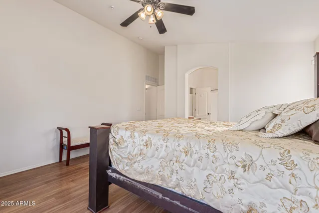 a bedroom with a bed and a dresser