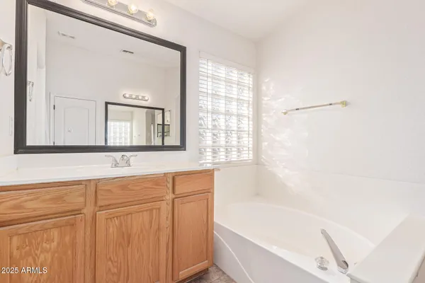 a bathroom with a bathtub and a sink