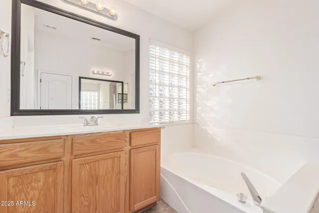 a bathroom with a bathtub and a sink