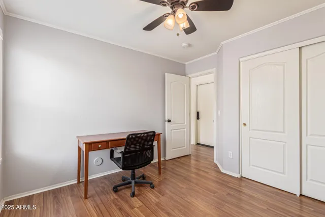 a view of a workspace with wooden floor