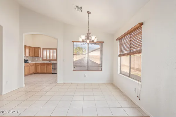 a view of a room with window and cabinet