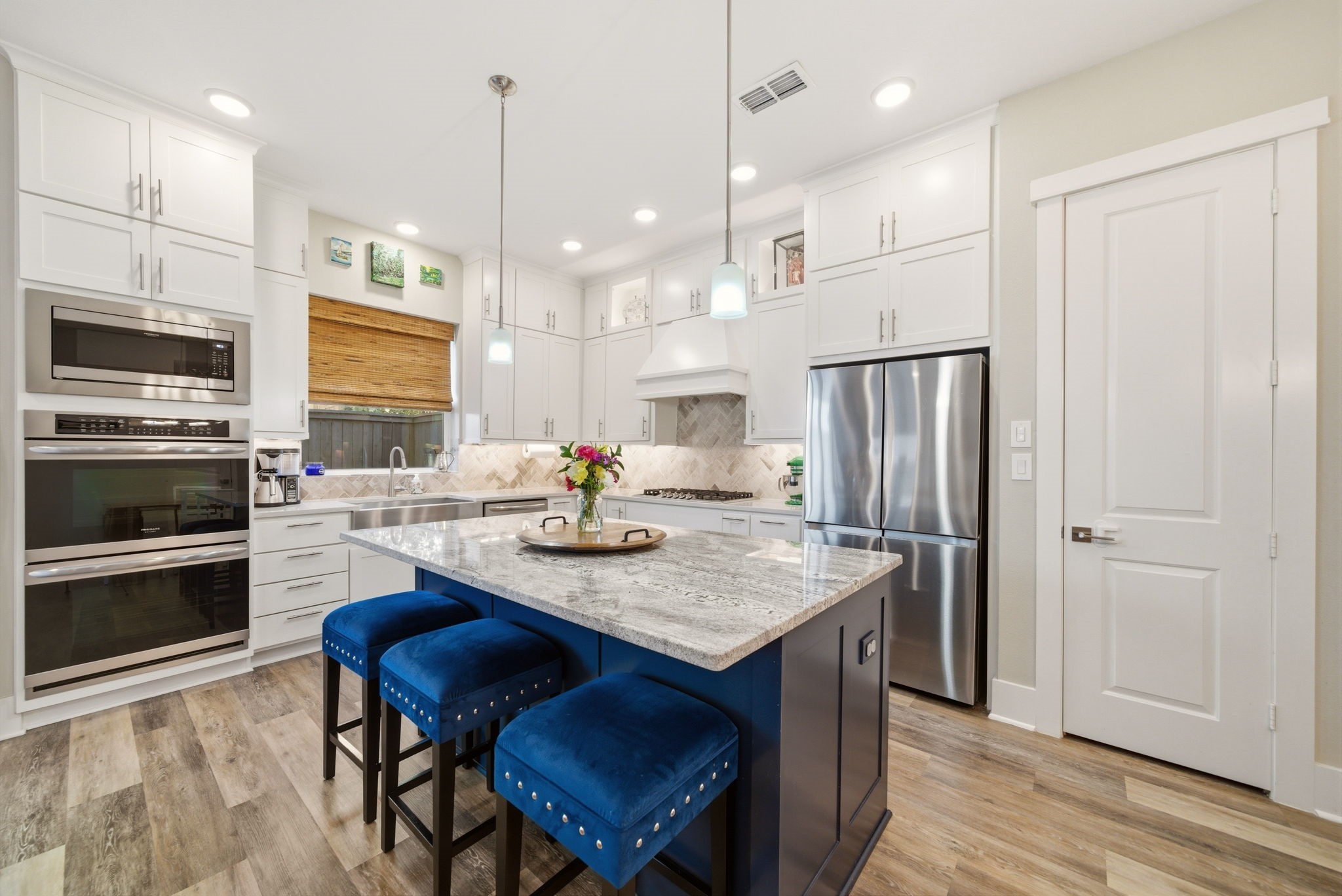 1417 Biondo Way Houston, TX 77008 - Photo 12 of 28 Designer kitchen with ceiling-height cabinetry, oversized island seating, double convection ovens, and extensive prep space.