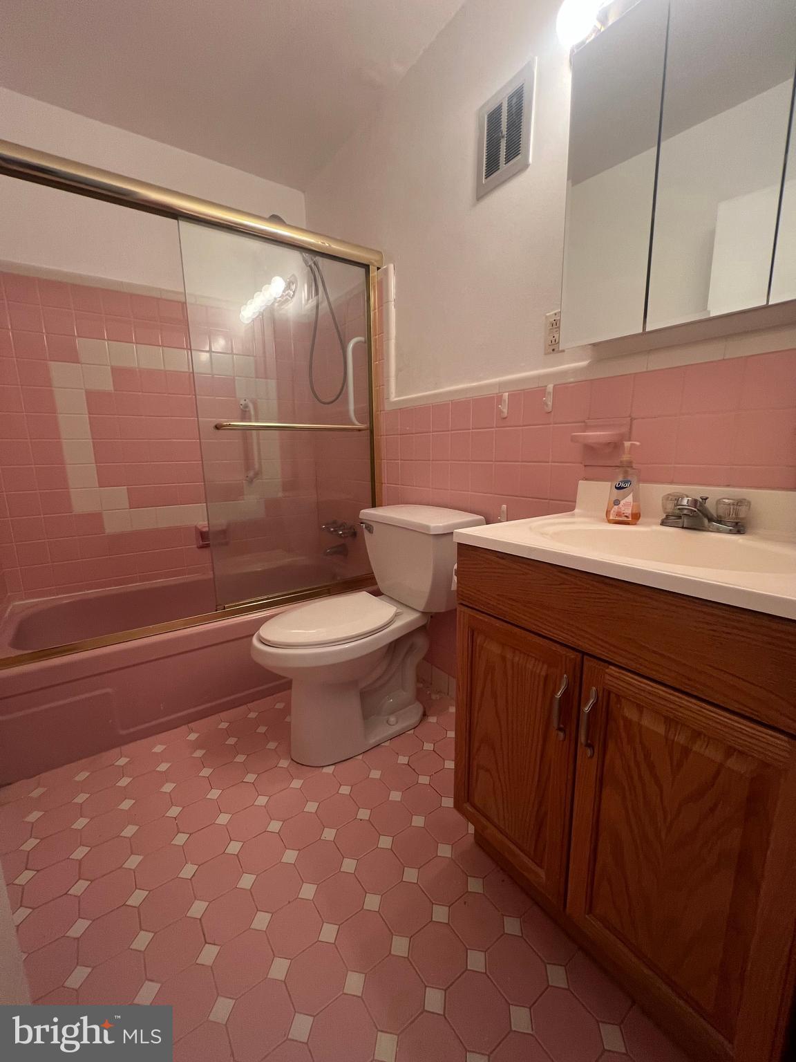 1635 Griffith Street Philadelphia, PA 19111 - Photo 14 of 17 a bathroom with a sink a toilet and shower