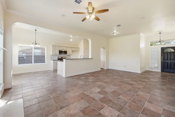 a view of a kitchen with furniture and a kitchen