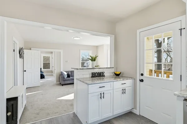 a kitchen with stainless steel appliances granite countertop a sink and cabinets