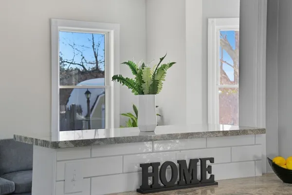 a bathroom with a sink a mirror and window