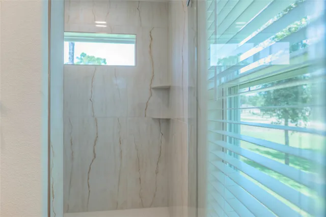 a view of walk in closet with wooden floor