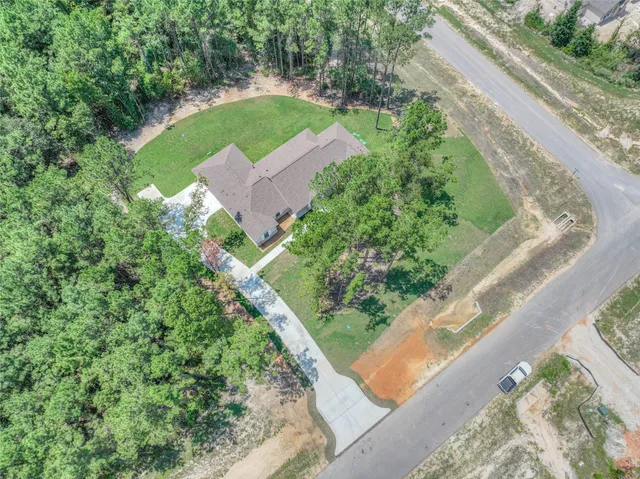 a view of a yard with potted plants