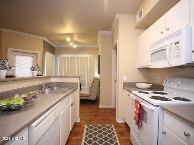 411 East Indian School Road, Unit 21 Phoenix, AZ 85012 - Photo 2 of 16 a kitchen with a sink stove and cabinets